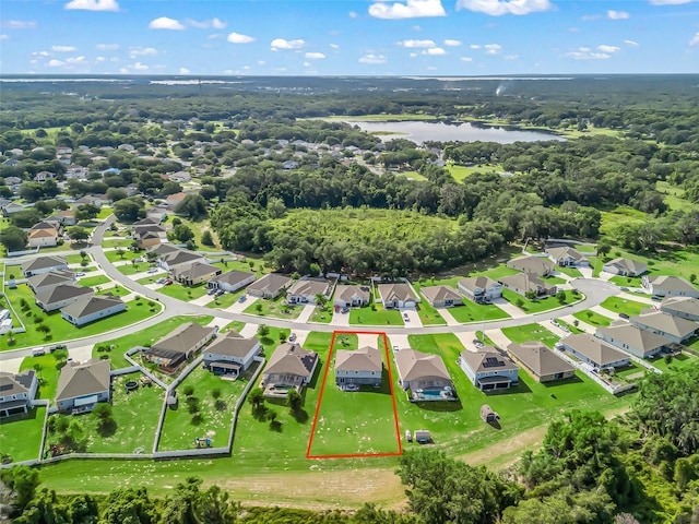 1824 Forest Glen Dr, Fruitland Park, FL 34731 - aerial perspective of suburban area featuring a large body of water and property boundaries highlighted