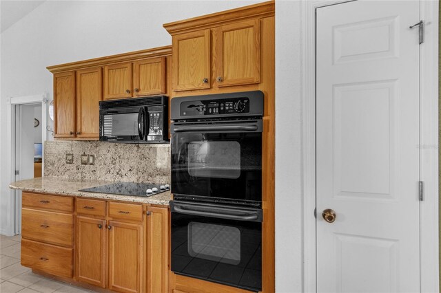 316 Dupont Cir, Howey In The Hills, FL 34737 - kitchen featuring black appliances, decorative backsplash, light tile patterned flooring, and light stone countertops