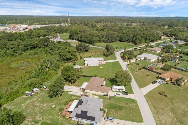 316 Dupont Cir, Howey In The Hills, FL 34737 - aerial view of property and surrounding area featuring a heavily wooded area