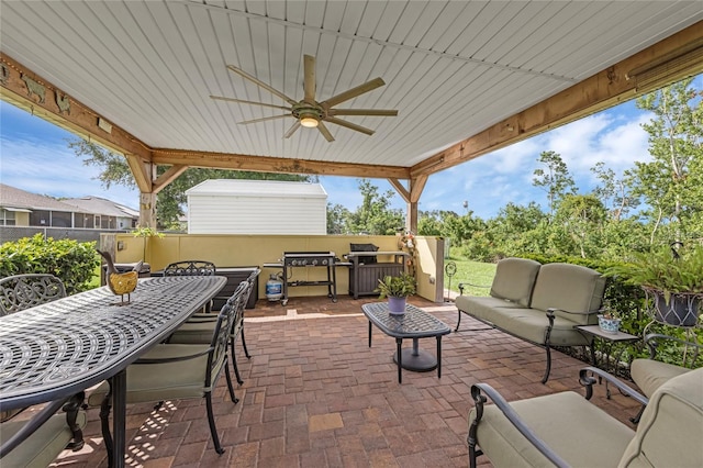 316 Dupont Cir, Howey In The Hills, FL 34737 - fenced backyard with an outdoor hangout area, a patio area, a ceiling fan, and outdoor dining space