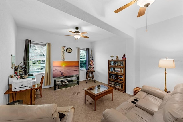 316 Dupont Cir, Howey In The Hills, FL 34737 - tiled living room featuring ceiling fan and baseboards