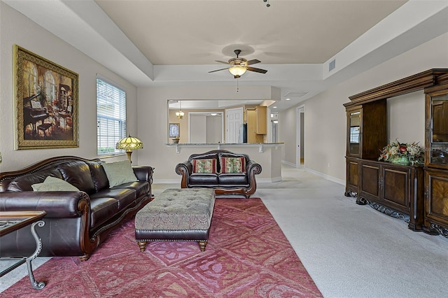 52 Camino Real Blvd, Howey In The Hills, FL 34737 - living room with light carpet, a ceiling fan, and baseboards