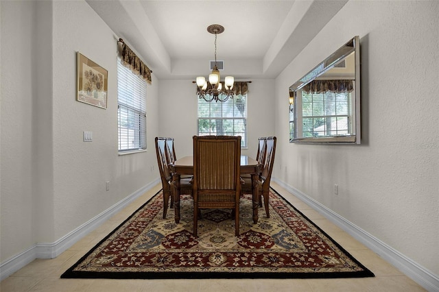 52 Camino Real Blvd, Howey In The Hills, FL 34737 - dining area with a chandelier, light tile patterned floors, and baseboards