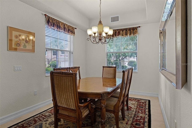 52 Camino Real Blvd, Howey In The Hills, FL 34737 - dining space with a chandelier, light tile patterned flooring, and baseboards