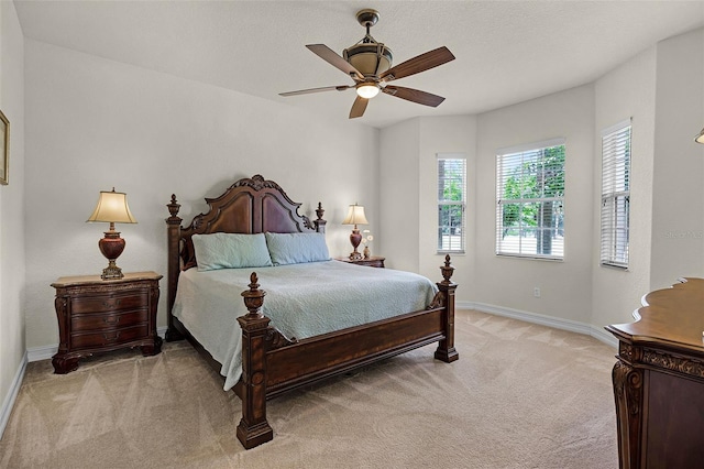 52 Camino Real Blvd, Howey In The Hills, FL 34737 - bedroom with light carpet, baseboards, and ceiling fan