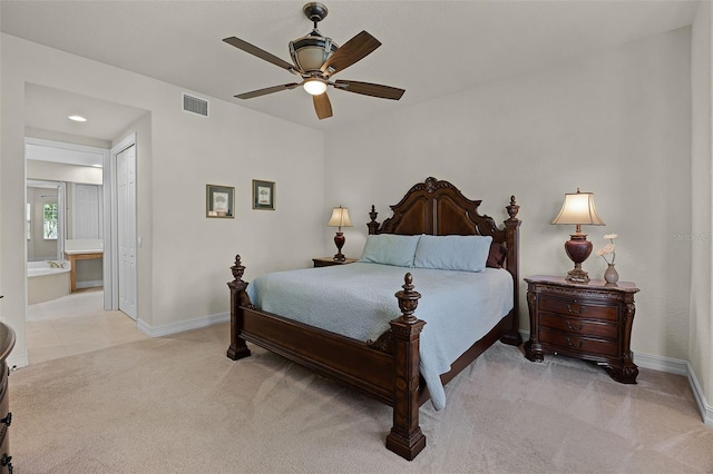 52 Camino Real Blvd, Howey In The Hills, FL 34737 - bedroom featuring light carpet, baseboards, ensuite bathroom, ceiling fan, and recessed lighting