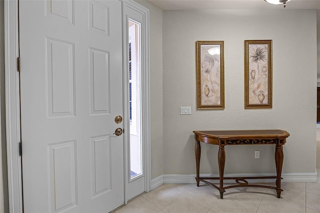 52 Camino Real Blvd, Howey In The Hills, FL 34737 - entrance foyer with baseboards and light tile patterned flooring