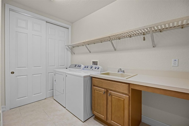 52 Camino Real Blvd, Howey In The Hills, FL 34737 - laundry area with independent washer and dryer, light tile patterned floors, cabinet space, an office area, and a textured ceiling