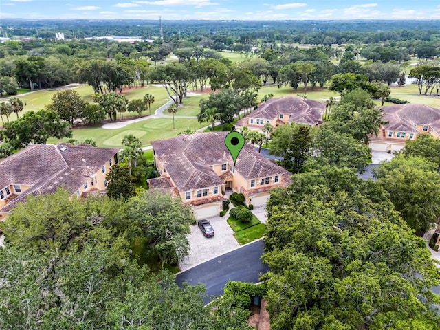 52 Camino Real Blvd, Howey In The Hills, FL 34737 - aerial view of a golf course and a tree filled landscape