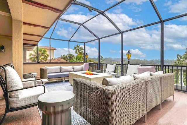 52 Camino Real Blvd, Howey In The Hills, FL 34737 - view of patio with an outdoor living space with a fire pit and a lanai