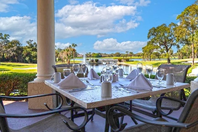 52 Camino Real Blvd, Howey In The Hills, FL 34737 - view of patio featuring a water view