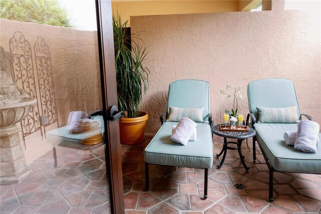 52 Camino Real Blvd, Howey In The Hills, FL 34737 - sitting room featuring stone finish floors