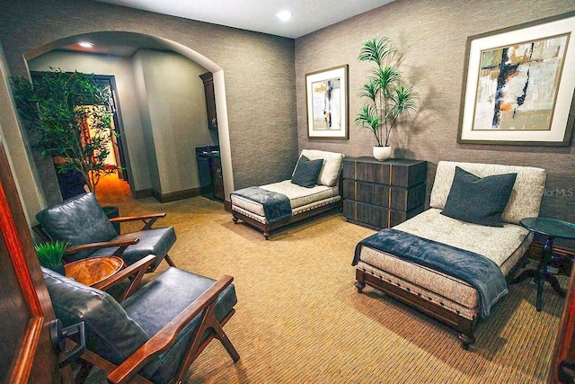 52 Camino Real Blvd, Howey In The Hills, FL 34737 - sitting room featuring arched walkways, carpet flooring, recessed lighting, and baseboards