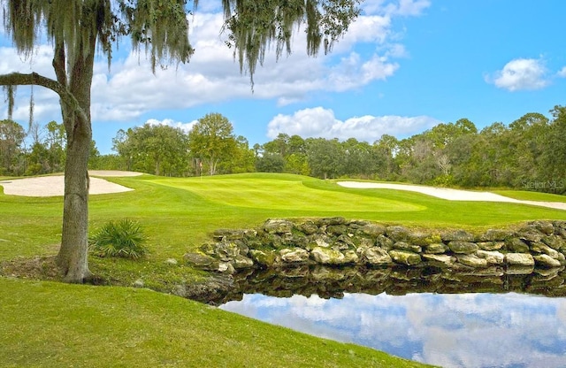 52 Camino Real Blvd, Howey In The Hills, FL 34737 - view of home's community featuring view of golf course, view of wooded area, and a yard