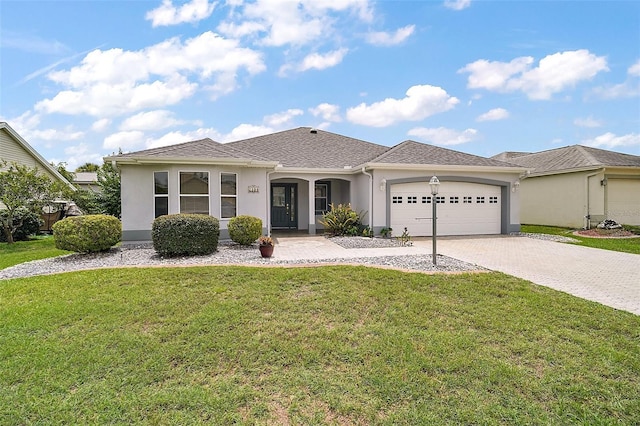 2104 Gerardo Ave, The Villages, FL 32159 - single story home featuring stucco siding, a garage, decorative driveway, and a front yard