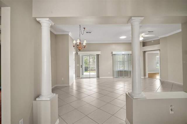 2104 Gerardo Ave, The Villages, FL 32159 - empty room featuring ornamental molding, light tile patterned flooring, ornate columns, baseboards, and a ceiling fan