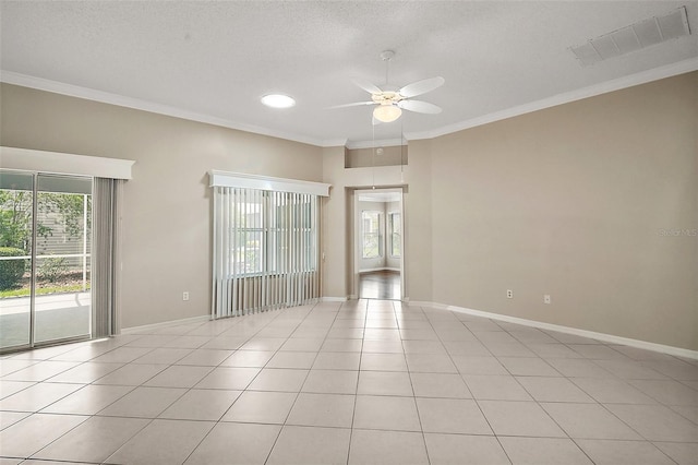 2104 Gerardo Ave, The Villages, FL 32159 - empty room featuring a ceiling fan, crown molding, light tile patterned floors, a textured ceiling, and baseboards
