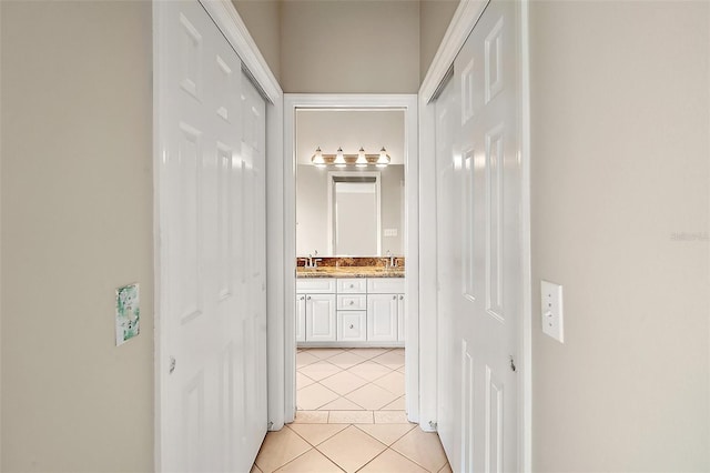 2104 Gerardo Ave, The Villages, FL 32159 - corridor with light tile patterned flooring and a sink