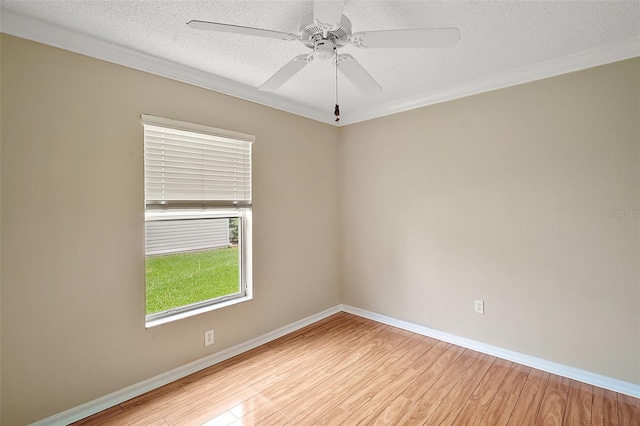 2104 Gerardo Ave, The Villages, FL 32159 - unfurnished room featuring wood finished floors, a textured ceiling, baseboards, a ceiling fan, and ornamental molding
