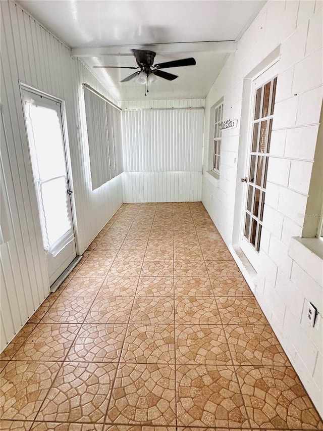 679 Ave Q SE, Winter Haven, FL 33880 - unfurnished sunroom featuring a ceiling fan