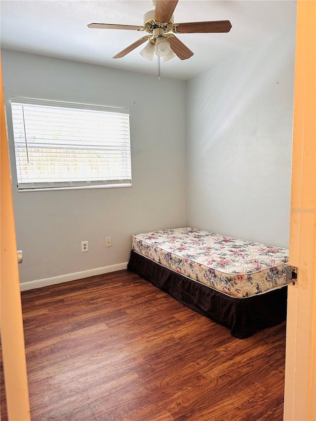 679 Ave Q SE, Winter Haven, FL 33880 - bedroom with wood finished floors and ceiling fan