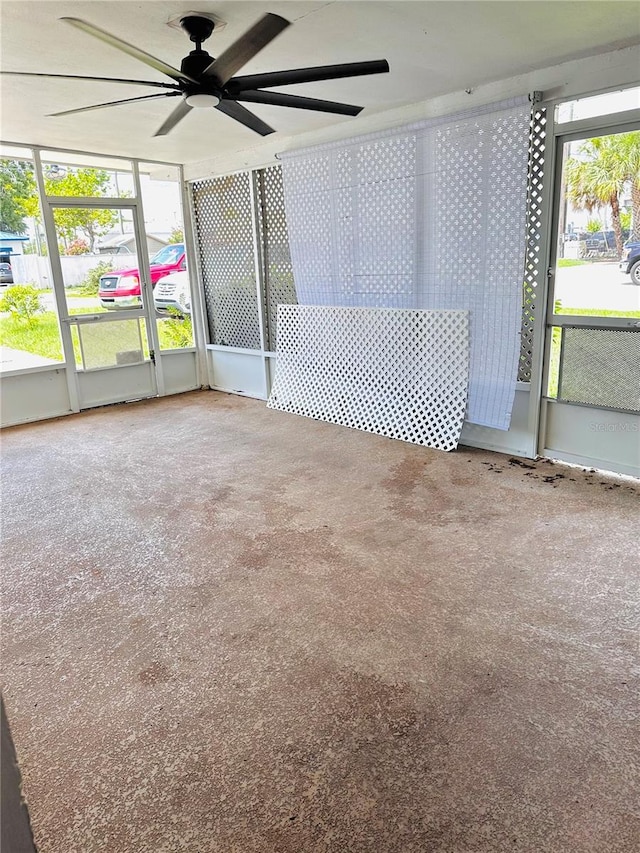 679 Ave Q SE, Winter Haven, FL 33880 - unfurnished sunroom featuring a ceiling fan