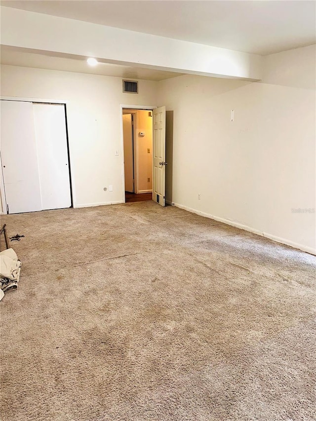 679 Ave Q SE, Winter Haven, FL 33880 - carpeted empty room featuring baseboards