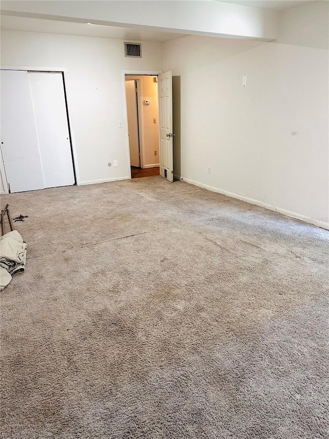 679 Ave Q SE, Winter Haven, FL 33880 - carpeted empty room with baseboards