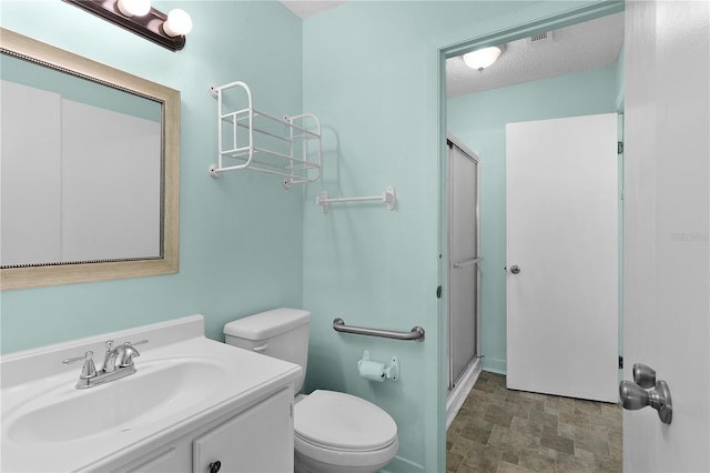 504 Silver Crse Unit A, Ocala, FL 34472 - bathroom featuring toilet, a shower stall, vanity, and a textured ceiling