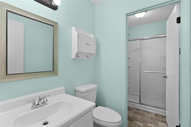 504 Silver Crse Unit A, Ocala, FL 34472 - full bath featuring a shower stall, a textured ceiling, toilet, vanity, and stone finish flooring