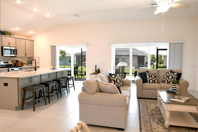 6301 Danielson Loop, The Villages, FL 32163 - living room featuring healthy amount of natural light, lofted ceiling, a ceiling fan, and recessed lighting