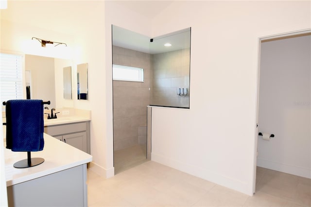 6301 Danielson Loop, The Villages, FL 32163 - bathroom with vanity, a walk in shower, and tile patterned flooring