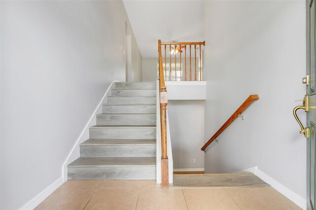 2745 Shearwater St, Clermont, FL 34711 - stairs featuring tile patterned flooring and baseboards