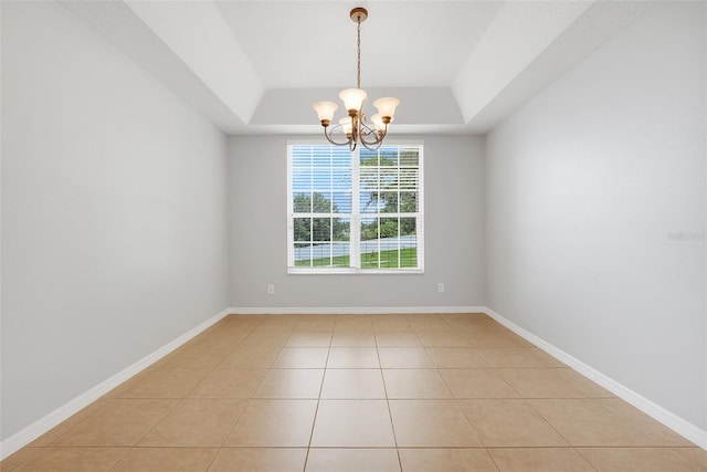 2745 Shearwater St, Clermont, FL 34711 - spare room with a raised ceiling, a chandelier, and light tile patterned flooring