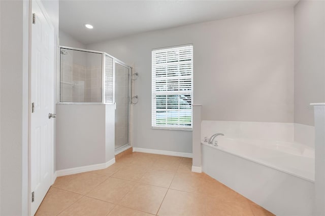 2745 Shearwater St, Clermont, FL 34711 - full bathroom featuring tile patterned floors, a bath, a stall shower, and recessed lighting