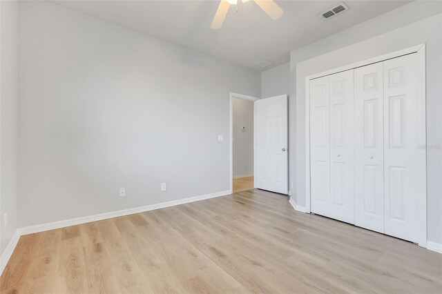 2745 Shearwater St, Clermont, FL 34711 - unfurnished bedroom with light wood-style floors, a closet, and ceiling fan