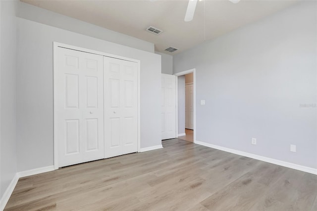 2745 Shearwater St, Clermont, FL 34711 - unfurnished bedroom featuring wood finished floors, a closet, and a ceiling fan