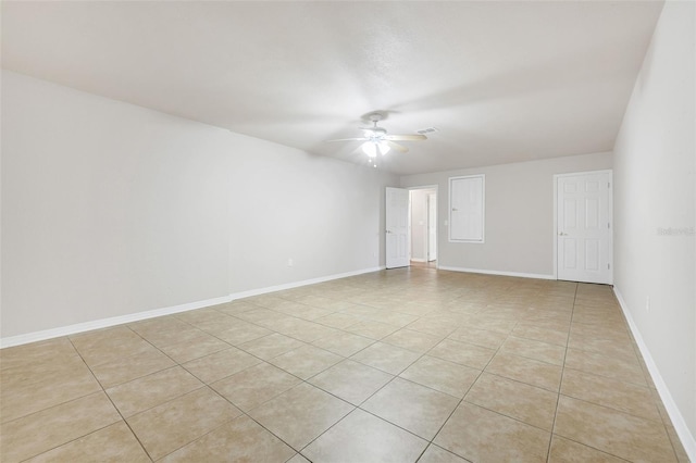 2745 Shearwater St, Clermont, FL 34711 - empty room with a ceiling fan and light tile patterned floors