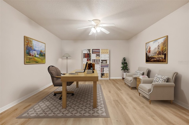 2745 Shearwater St, Clermont, FL 34711 - home office with ceiling fan, light wood-style floors, and a textured ceiling
