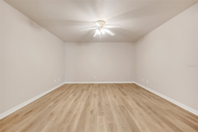 2745 Shearwater St, Clermont, FL 34711 - empty room with a ceiling fan, light wood-type flooring, and a textured ceiling