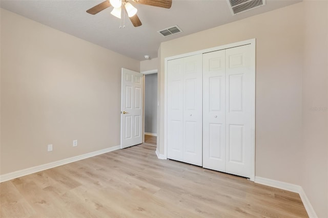 2745 Shearwater St, Clermont, FL 34711 - unfurnished bedroom featuring light wood-type flooring, a closet, and a ceiling fan