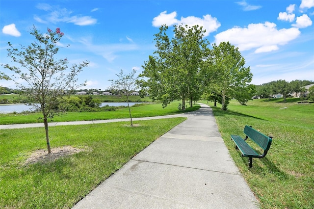 2745 Shearwater St, Clermont, FL 34711 - surrounding community featuring a water view and a lawn