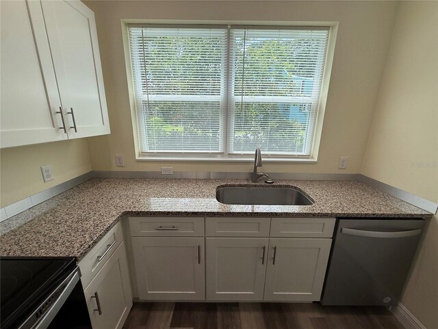 501 N Simpson St, Mount Dora, FL 32757 - kitchen featuring dishwasher, white cabinetry, black range with electric cooktop, and light stone counters