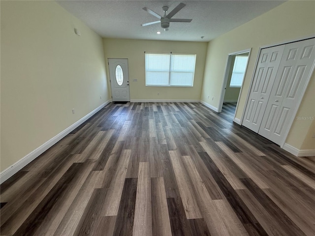 501 N Simpson St, Mount Dora, FL 32757 - unfurnished living room with a ceiling fan and dark wood-style flooring