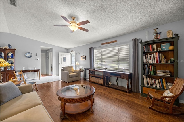 17533 SE 96th Ct, Summerfield, FL 34491 - living area featuring ceiling fan, hardwood / wood-style floors, vaulted ceiling, and a textured ceiling