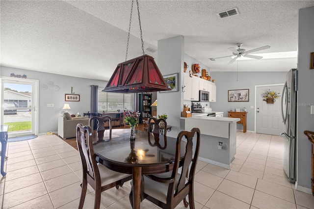 17533 SE 96th Ct, Summerfield, FL 34491 - dining space with light tile patterned flooring, a textured ceiling, healthy amount of natural light, and ceiling fan