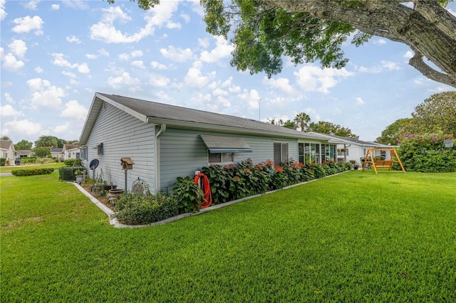 17533 SE 96th Ct, Summerfield, FL 34491 - view of side of home with a lawn