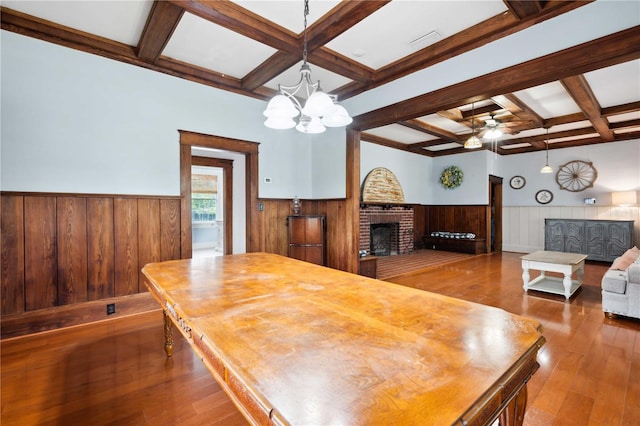263 NE 1st St, Webster, FL 33597 - living area with wainscoting, coffered ceiling, beam ceiling, wood-type flooring, and a chandelier