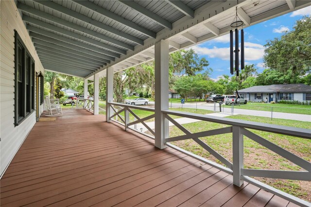 263 NE 1st St, Webster, FL 33597 - wooden porch featuring a lawn