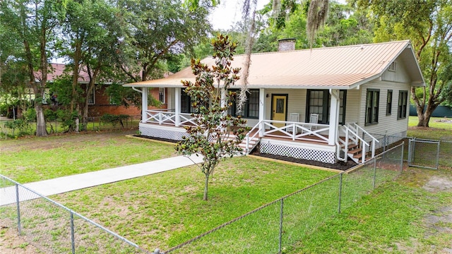 263 NE 1st St, Webster, FL 33597 - ranch-style home featuring a porch, a gate, a chimney, and metal roof